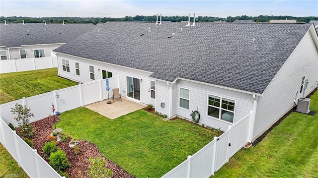 6624 Knob Creek Dr, Whitsett, NC 27377 - back of house featuring central air condition unit, a patio area, and a shingled roof