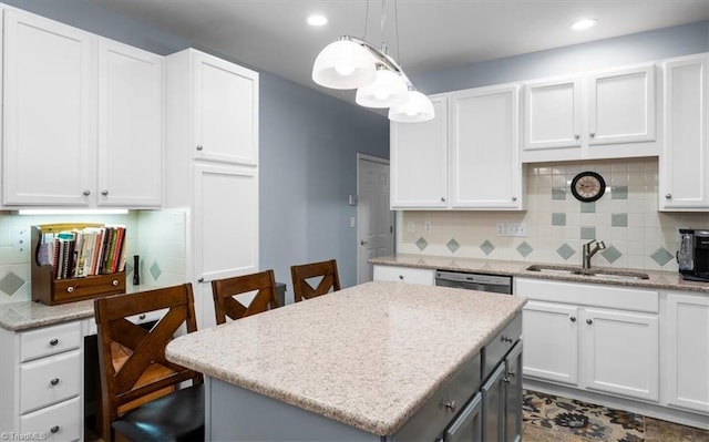 3702 Belfry Ct, Greensboro, NC 27410 - kitchen with a sink, backsplash, white cabinetry, pendant lighting, and recessed lighting