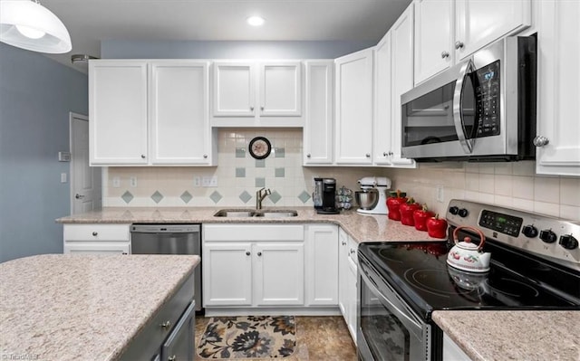 3702 Belfry Ct, Greensboro, NC 27410 - kitchen with stainless steel appliances, a sink, white cabinetry, tasteful backsplash, and recessed lighting