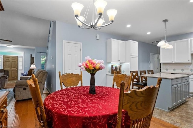 3702 Belfry Ct, Greensboro, NC 27410 - dining space with wood finished floors, a chandelier, and recessed lighting
