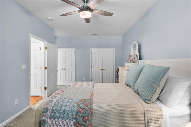 3702 Belfry Ct, Greensboro, NC 27410 - bedroom with multiple closets, baseboards, carpet, and ceiling fan