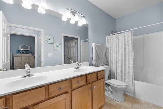 3702 Belfry Ct, Greensboro, NC 27410 - bathroom featuring double vanity, toilet, and shower / bath combo with shower curtain