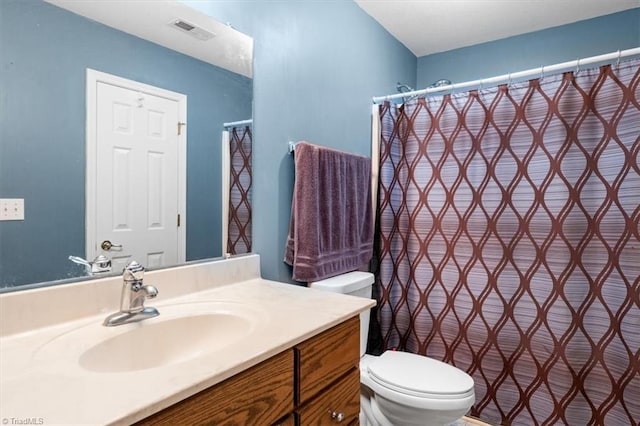 3702 Belfry Ct, Greensboro, NC 27410 - bathroom with toilet, vanity, and a shower with curtain