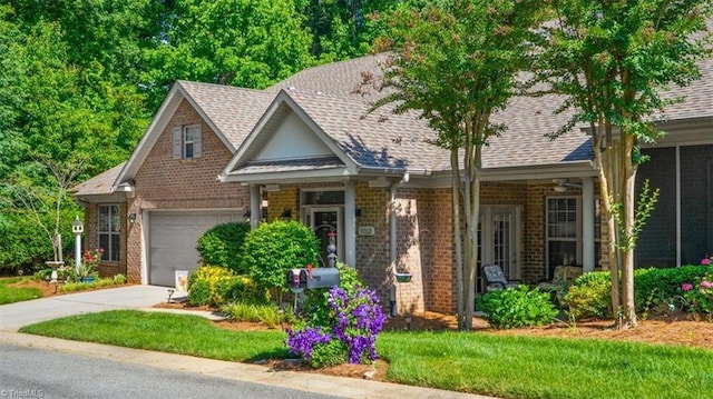 3702 Belfry Ct, Greensboro, NC 27410 - view of front of house featuring brick siding, an attached garage, driveway, and a shingled roof