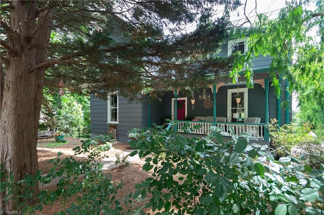 627 Mulberry St, Winston-Salem, NC 27101 - obstructed view of property with a porch
