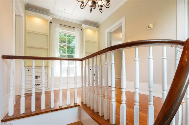627 Mulberry St, Winston-Salem, NC 27101 - stairs with ornamental molding, wood finished floors, and a chandelier