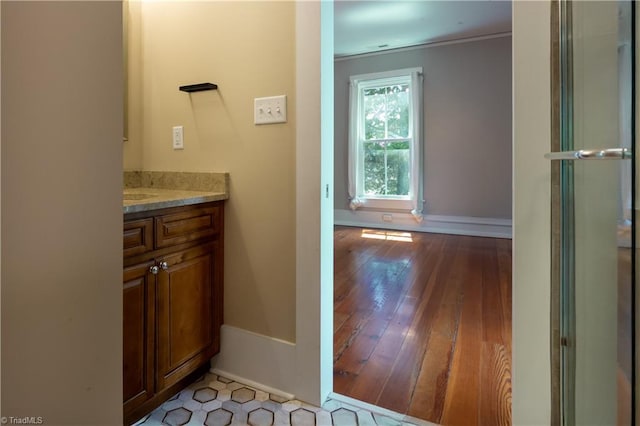 627 Mulberry St, Winston-Salem, NC 27101 - bathroom featuring vanity, wood finished floors, and crown molding