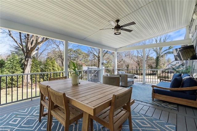 wooden deck with an outdoor hangout area, outdoor dining space, and a ceiling fan