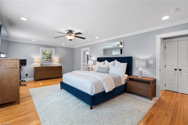 bedroom with recessed lighting, crown molding, and light wood finished floors