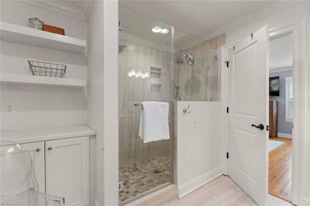 full bathroom featuring a shower stall and crown molding