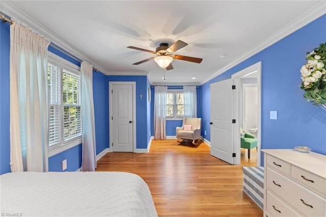 bedroom with ceiling fan, baseboards, light wood-type flooring, and ornamental molding