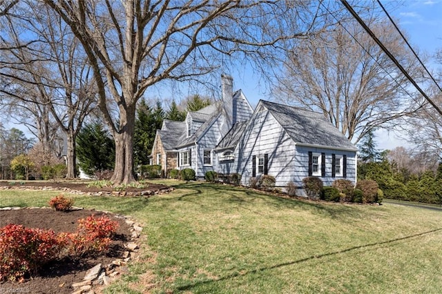 view of home's exterior featuring a yard and a chimney