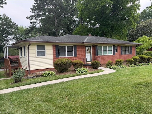 1321 Arbor Dr, Salisbury, NC 28144 - ranch-style home with a front yard, brick siding, roof with shingles, and view of scattered trees