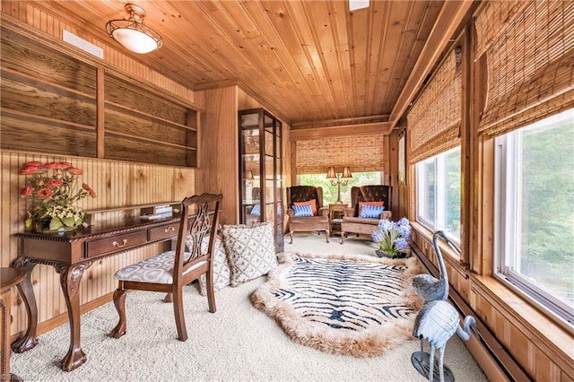 office with carpet floors, wooden ceiling, and wooden walls