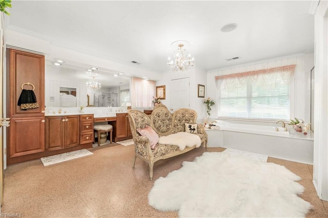 sitting room with a notable chandelier, ornamental molding, and light tile patterned flooring