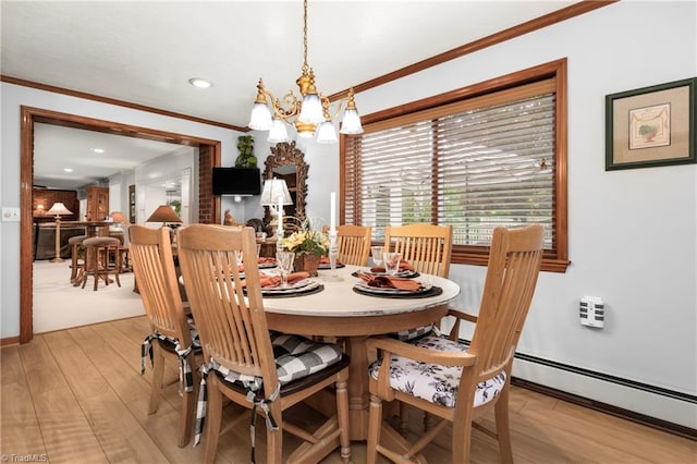 dining space with a notable chandelier, crown molding, light wood-type flooring, and baseboard heating