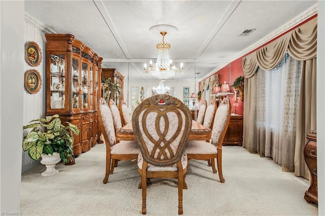 carpeted dining space with a chandelier