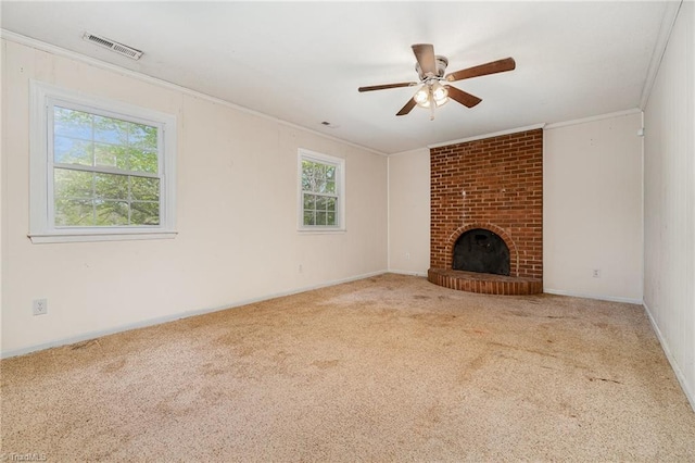 unfurnished living room featuring a ceiling fan, crown molding, carpet, and visible vents