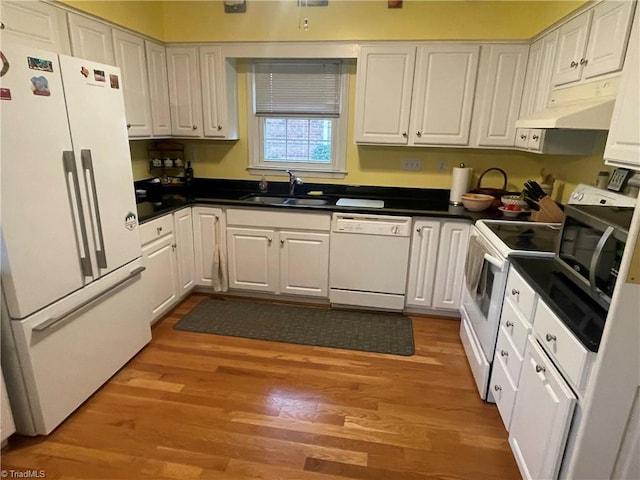 kitchen with white cabinetry, white appliances, sink, and light hardwood / wood-style flooring