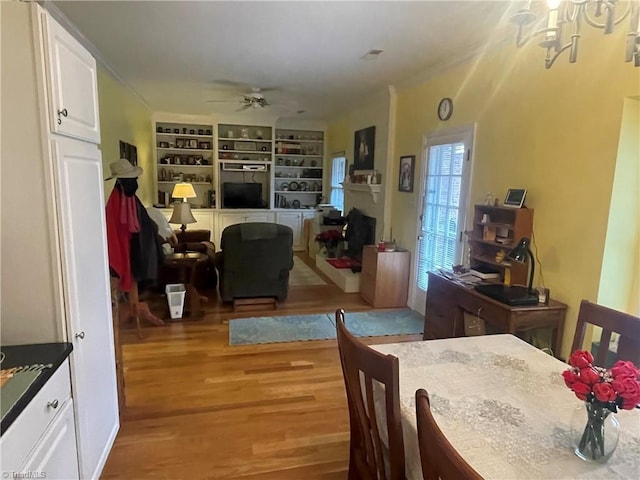 dining room featuring light hardwood / wood-style floors and ceiling fan