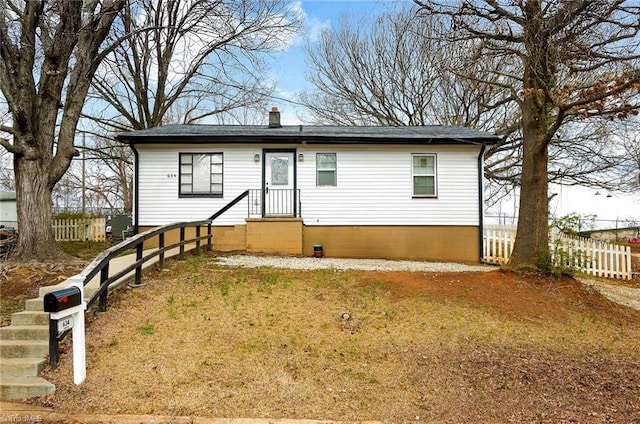 view of front facade featuring crawl space and fence