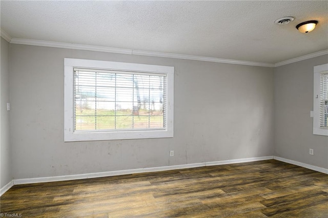 unfurnished room with crown molding, dark wood finished floors, visible vents, a textured ceiling, and baseboards