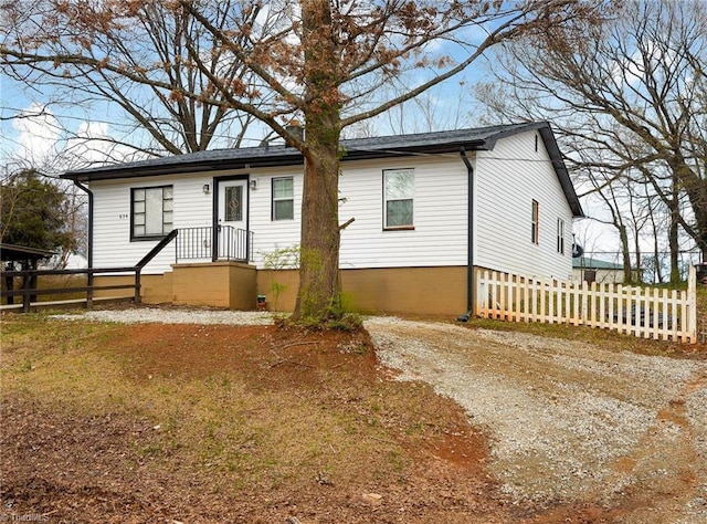 view of front of house featuring fence