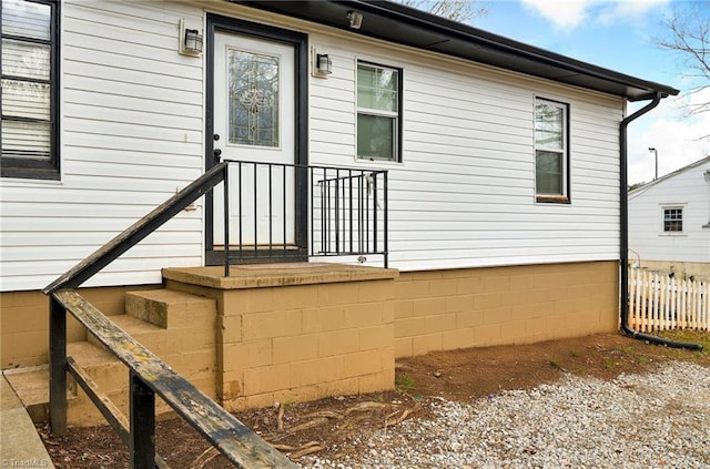 property entrance with fence