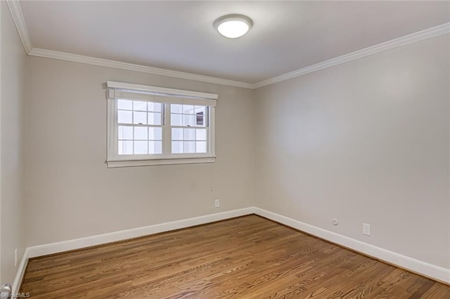 unfurnished room with crown molding and hardwood / wood-style floors