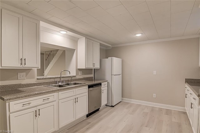 kitchen featuring stainless steel dishwasher, ornamental molding, sink, and white cabinets