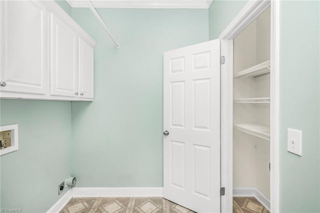 laundry room with hookup for a washing machine, cabinets, and light parquet floors