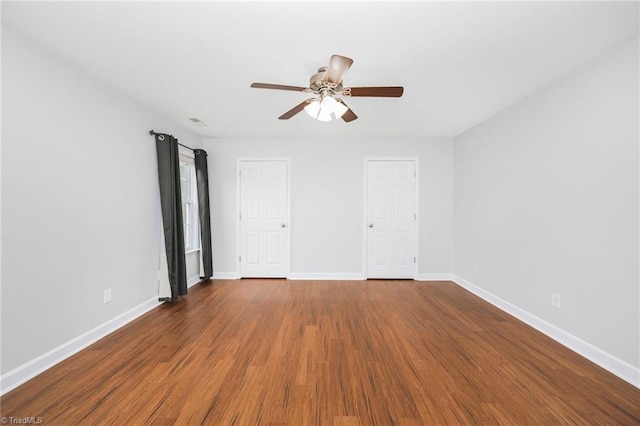 unfurnished bedroom with ceiling fan and hardwood / wood-style flooring