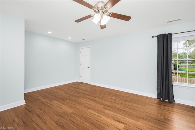 unfurnished room featuring ceiling fan and wood-type flooring