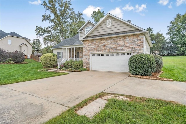 view of front of house with a garage and a front lawn