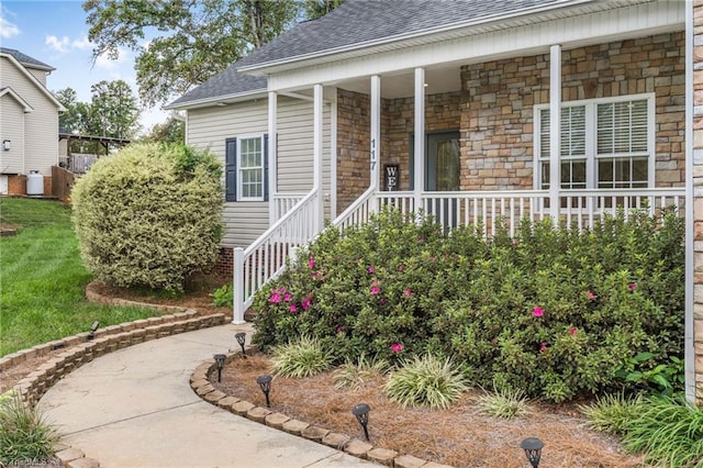 property entrance with covered porch