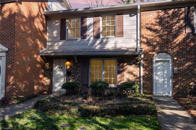 view of front of home with brick siding