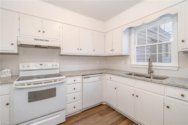 kitchen featuring under cabinet range hood, white appliances, wood finished floors, a sink, and white cabinets