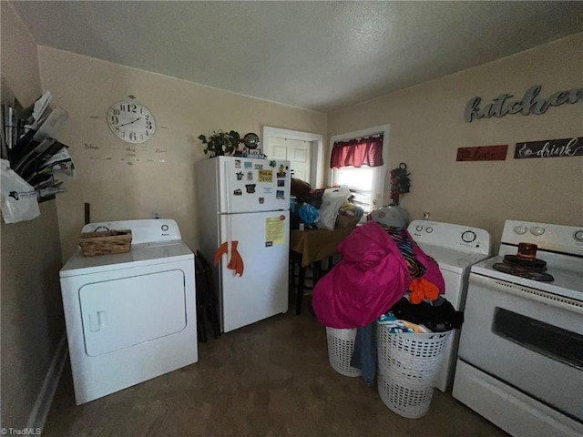 clothes washing area featuring laundry area and washer and clothes dryer