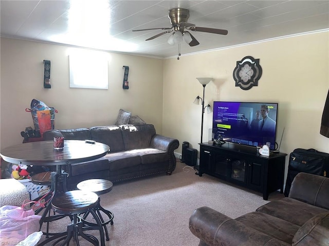 living room featuring carpet floors, crown molding, and ceiling fan