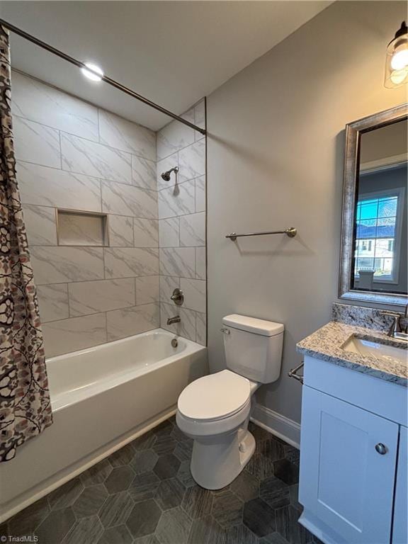 full bathroom with tile patterned floors, vanity, toilet, and shower / bathtub combination with curtain