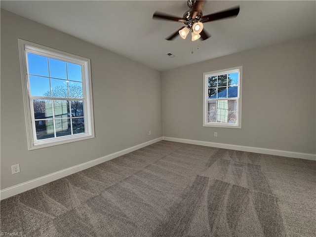 carpeted empty room with ceiling fan