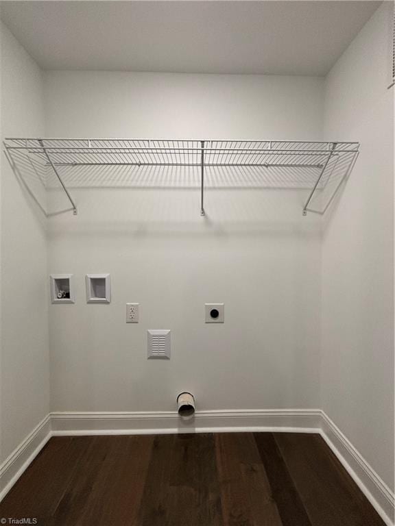 clothes washing area featuring electric dryer hookup, hookup for a washing machine, and hardwood / wood-style flooring