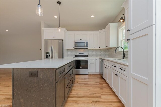 kitchen featuring a sink, white cabinetry, and appliances with stainless steel finishes