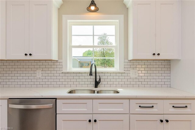 kitchen featuring a sink, decorative backsplash, white cabinets, and dishwasher