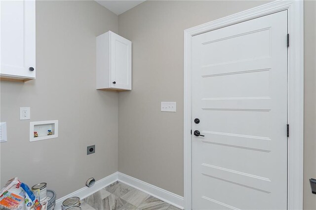 laundry area with marble finish floor, baseboards, hookup for a washing machine, electric dryer hookup, and cabinet space