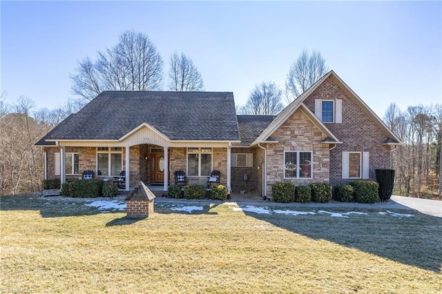 view of front of house featuring a porch and a front yard