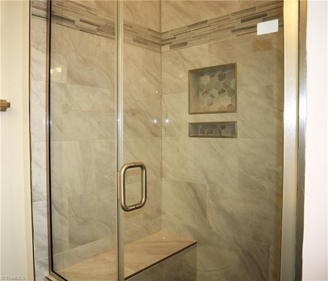 bathroom featuring an enclosed shower