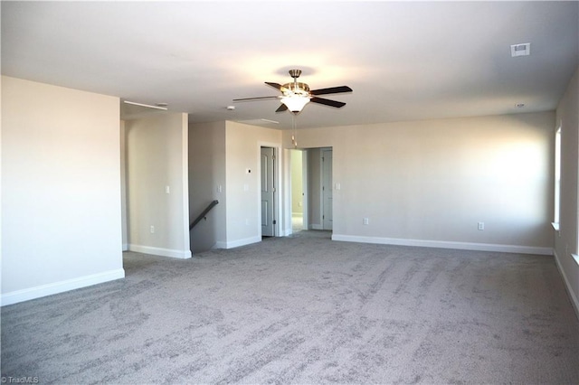 carpeted empty room with ceiling fan