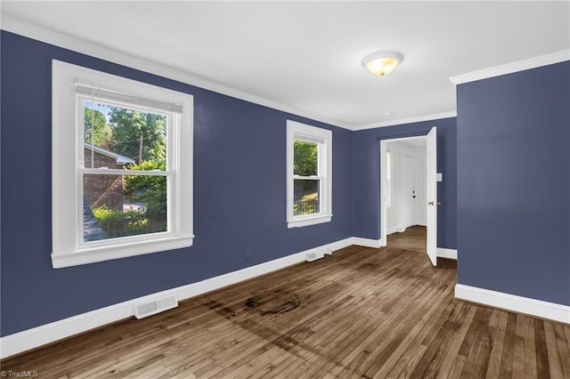 608 Spruce St, High Point, NC 27262 - spare room featuring wood finished floors, plenty of natural light, and ornamental molding