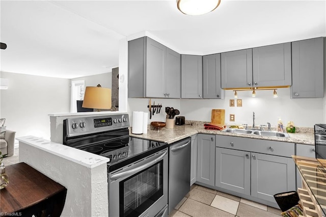 608 Spruce St, High Point, NC 27262 - kitchen with appliances with stainless steel finishes, gray cabinetry, and light stone countertops